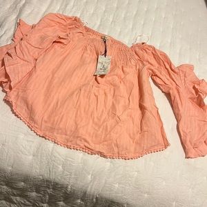 Peach blouse with ruffle sleeve